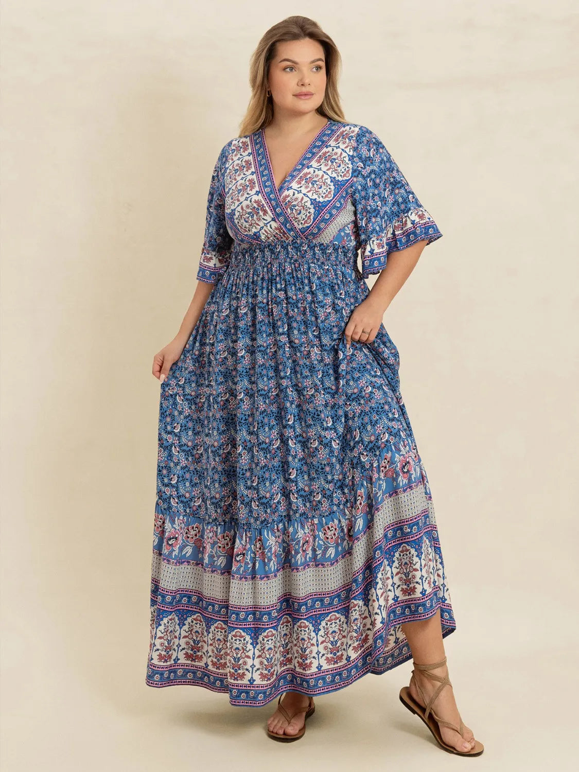 Plus Size Printed Surplice Half Sleeve Dress - Premium Dresses from Trendsi - Just $48.99! Shop now at Handbags Specialist Headquarter