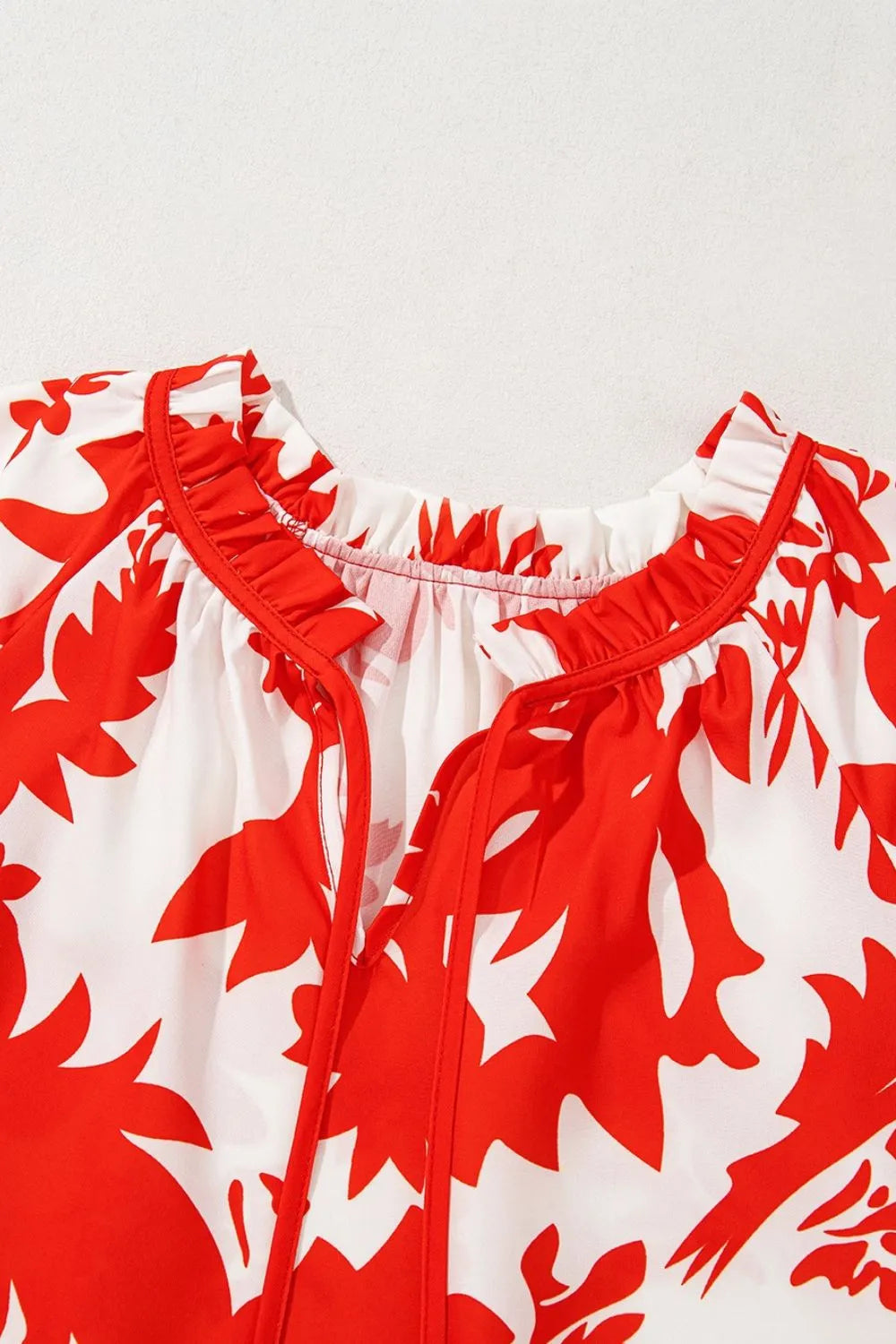 Plant Print Tiered Ruffled Sleeve Tie Neck Blouse - Premium Tops from Trendsi - Just $26.02! Shop now at Handbags Specialist Headquarter