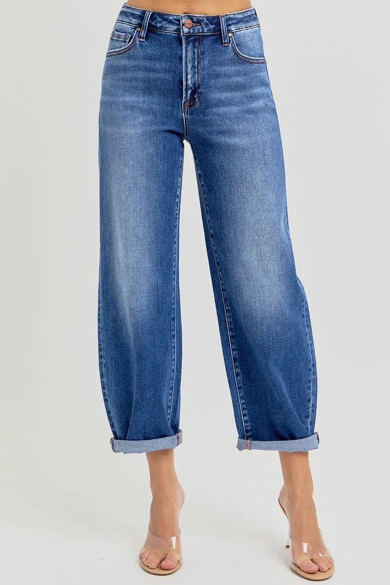 Plus size high-rise crop barrel jeans with rolled cuffs and medium wash.