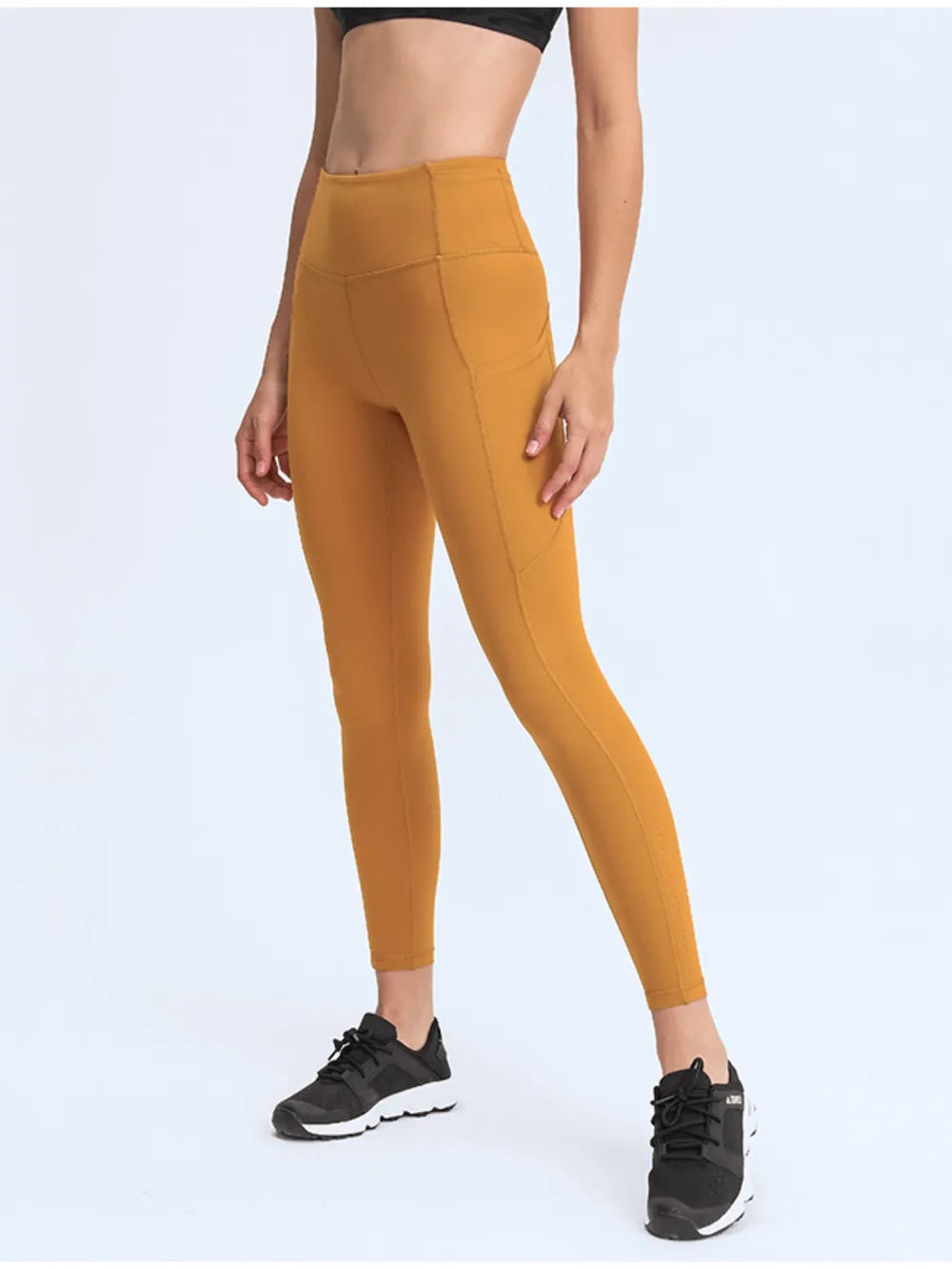Millennia Wide Waistband Leggings with Pockets - Premium Leggings from Trendsi - Just $67.08! Shop now at Handbags Specialist Headquarter