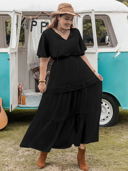 Plus Size Tie Neck Flutter Sleeve Dress - Premium Dresses from Trendsi - Just $41.99! Shop now at Handbags Specialist Headquarter