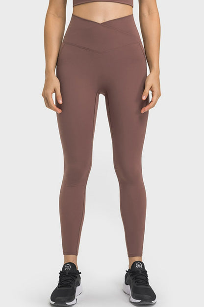 Millennia V-Waist Yoga Leggings with Pockets - Premium Leggings from Trendsi - Just $59.76! Shop now at Handbags Specialist Headquarter