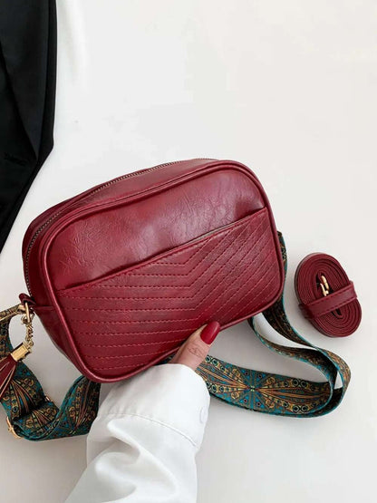 Tassel PU Leather Printed Strap Cassette Crossbody Bag - Premium Crossbody Bag from Trendsi - Just $22.99! Shop now at Handbags Specialist Headquarter