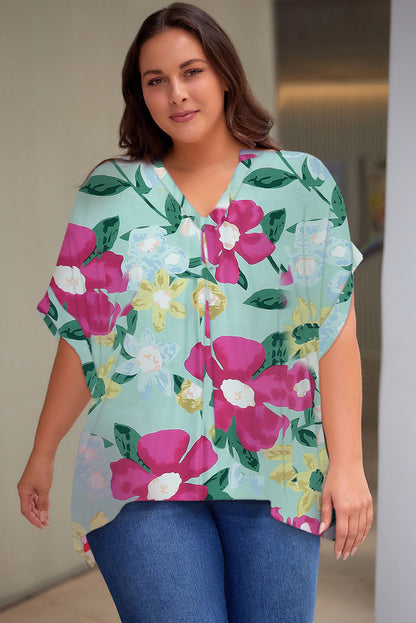 Plus Size Printed Notched Neck Half Sleeve Top - Premium Plus Size Shirts from Trendsi - Just $28! Shop now at Handbags Specialist Headquarter