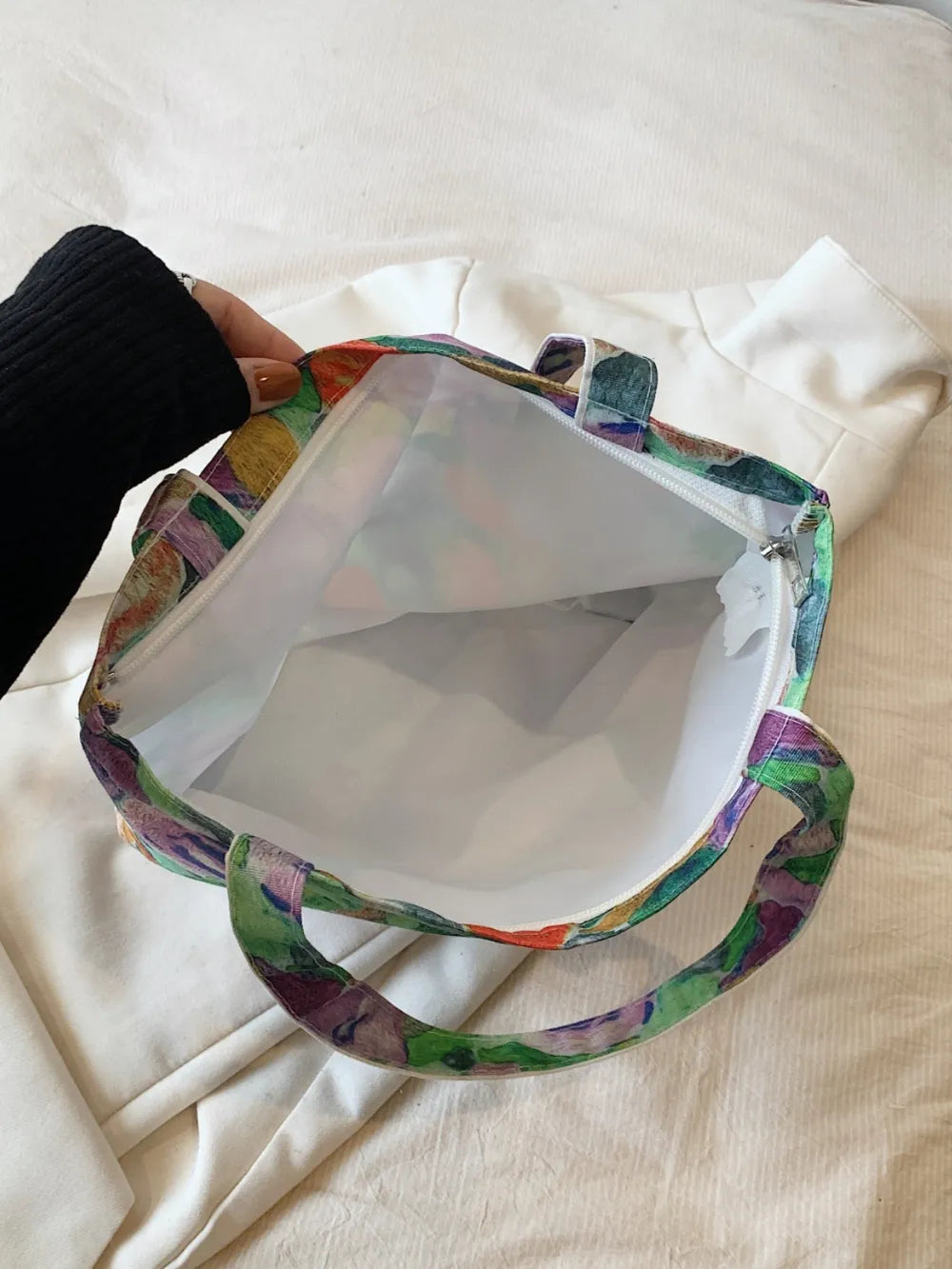 Printed Canvas Handbag with Zipper - Premium Handbags from Trendsi - Just $21.99! Shop now at Handbags Specialist Headquarter