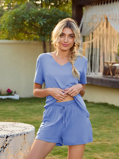 V-Neck Short Sleeve Top and Pocketed Shorts Lounge Set - Premium sleepwear from Trendsi - Just $31.99! Shop now at Handbags Specialist Headquarter