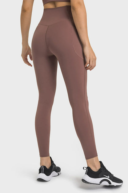 Millennia V-Waist Yoga Leggings with Pockets - Premium Leggings from Trendsi - Just $59.76! Shop now at Handbags Specialist Headquarter