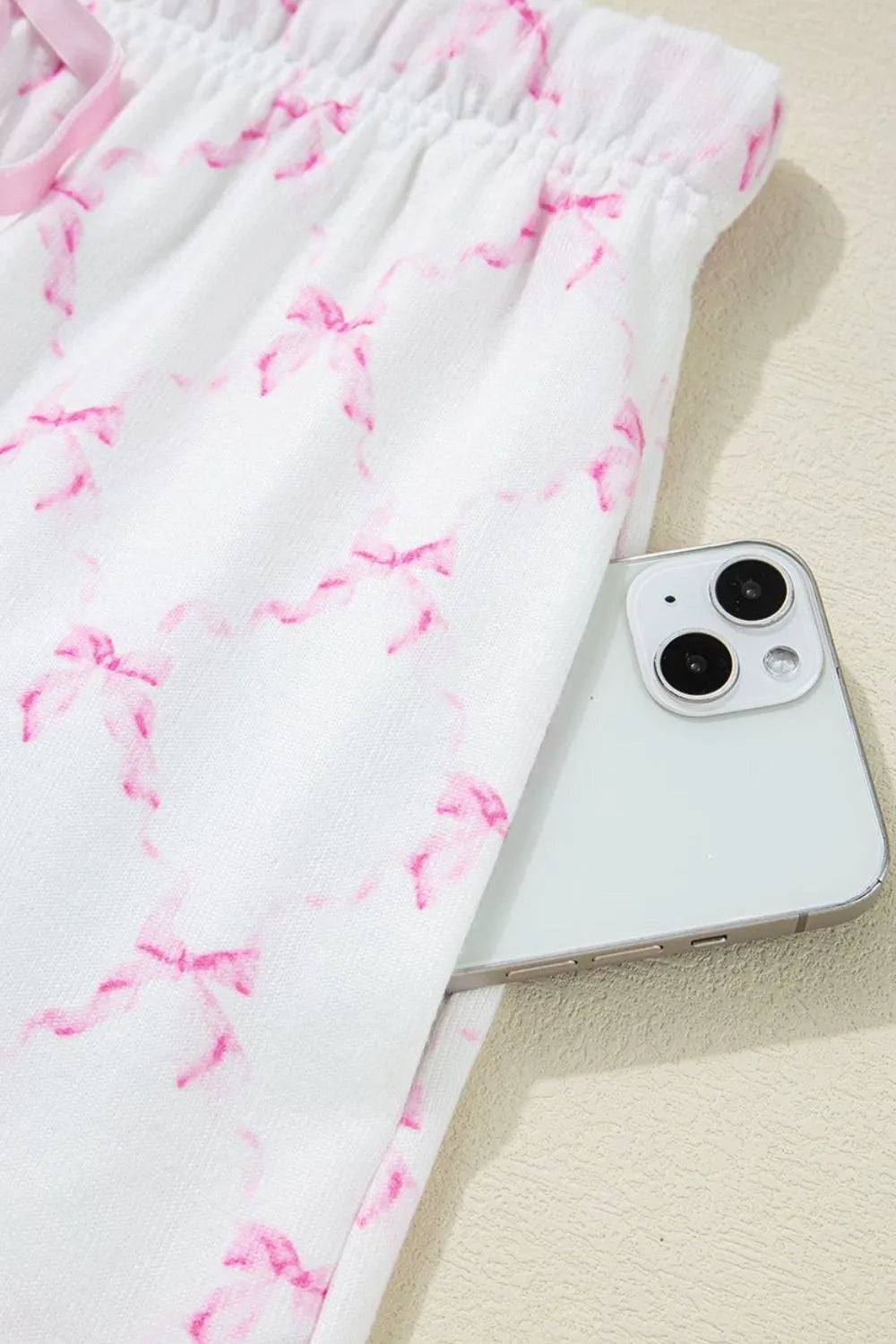 Bow Print Lettuce Trim Round Neck Top and Shorts Lounge Set - Premium Sleepwear from Trendsi - Just $32.14! Shop now at Handbags Specialist Headquarter