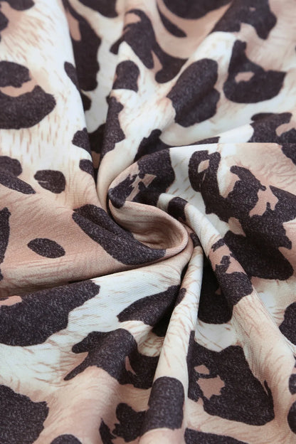 Plus Size Leopard Round Neck Blouse - Premium Plus Size Shirts from Trendsi - Just $21.48! Shop now at Handbags Specialist Headquarter