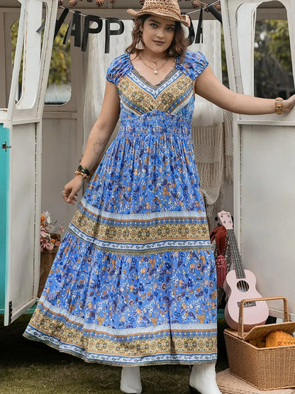 Plus Size Smocked Printed Cap Sleeve Dress - Premium Dresses from Trendsi - Just $38.99! Shop now at Handbags Specialist Headquarter