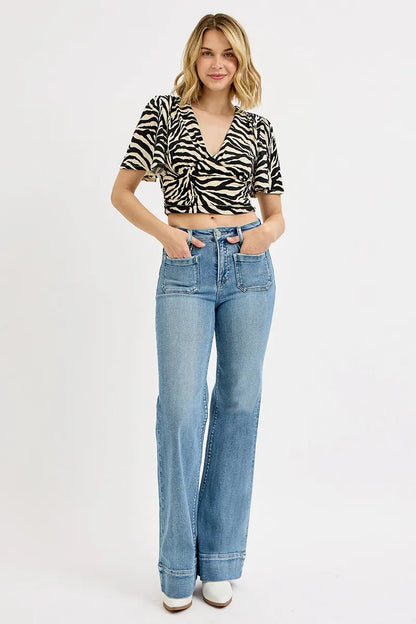 RISEN Full Size High Rise Wide Flare Patch Pocket Jeans Plus Size - Premium Women / Jeans & Denim from Trendsi - Just $66.99! Shop now at Handbags Specialist Headquarter