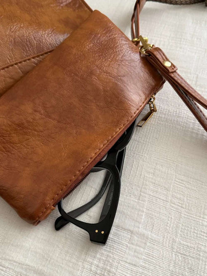 PU Leather Adjustable Strap Crossbody Bag with Pouch - Premium Crossbody Bag from Trendsi - Just $31.99! Shop now at Handbags Specialist Headquarter