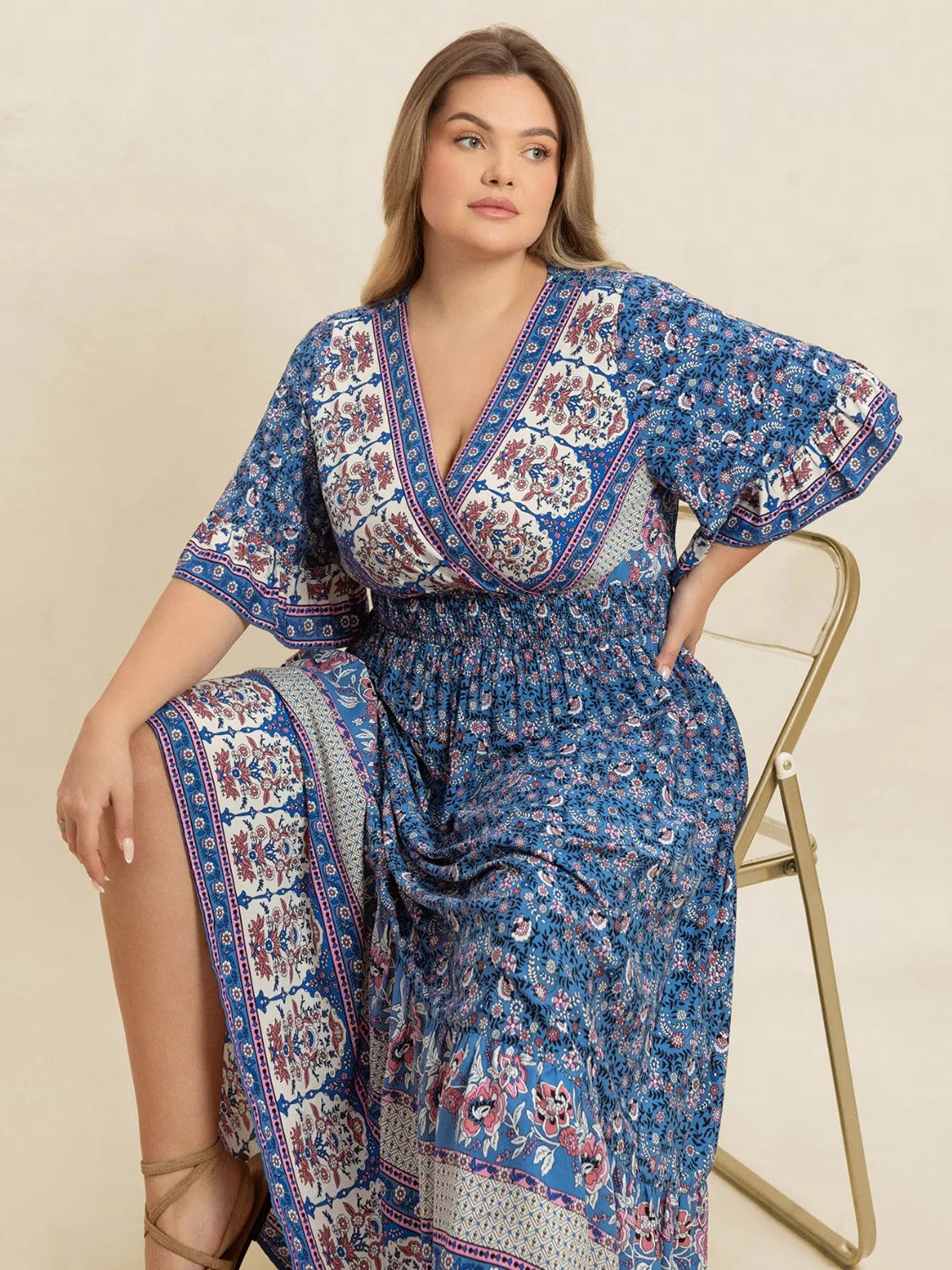 Plus Size Printed Surplice Half Sleeve Dress - Premium Dresses from Trendsi - Just $48.99! Shop now at Handbags Specialist Headquarter