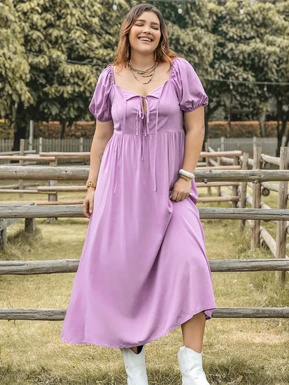 Plus Size Tie Neck Short Sleeve Dress - Premium Dresses from Trendsi - Just $35.99! Shop now at Handbags Specialist Headquarter