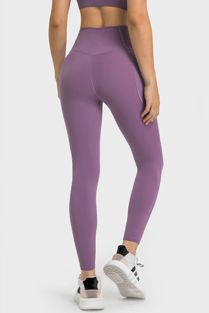 Millennia V-Waist Yoga Leggings with Pockets - Premium Leggings from Trendsi - Just $59.76! Shop now at Handbags Specialist Headquarter