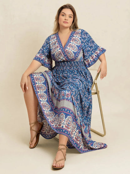 Plus Size Printed Surplice Half Sleeve Dress - Premium Dresses from Trendsi - Just $48.99! Shop now at Handbags Specialist Headquarter