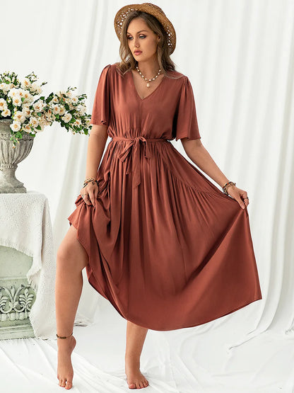 Plus Size V-Neck Flutter Sleeve Midi Dress - Premium Dresses from Trendsi - Just $46.99! Shop now at Handbags Specialist Headquarter