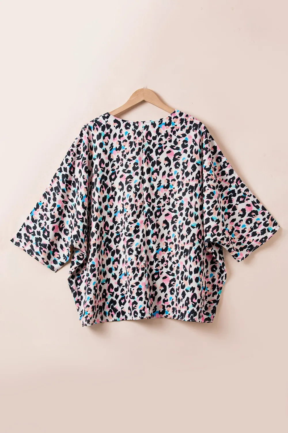 Plus Size Leopard V-Neck Three-Quarter Sleeve Blouse - Premium Plus Size Shirts from Trendsi - Just $24.32! Shop now at Handbags Specialist Headquarter