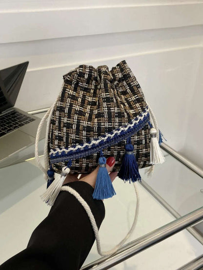 Tassel Trim Woven Bucket Crossbody Bag - Premium Crossbody Bag from Trendsi - Just $14.99! Shop now at Handbags Specialist Headquarter