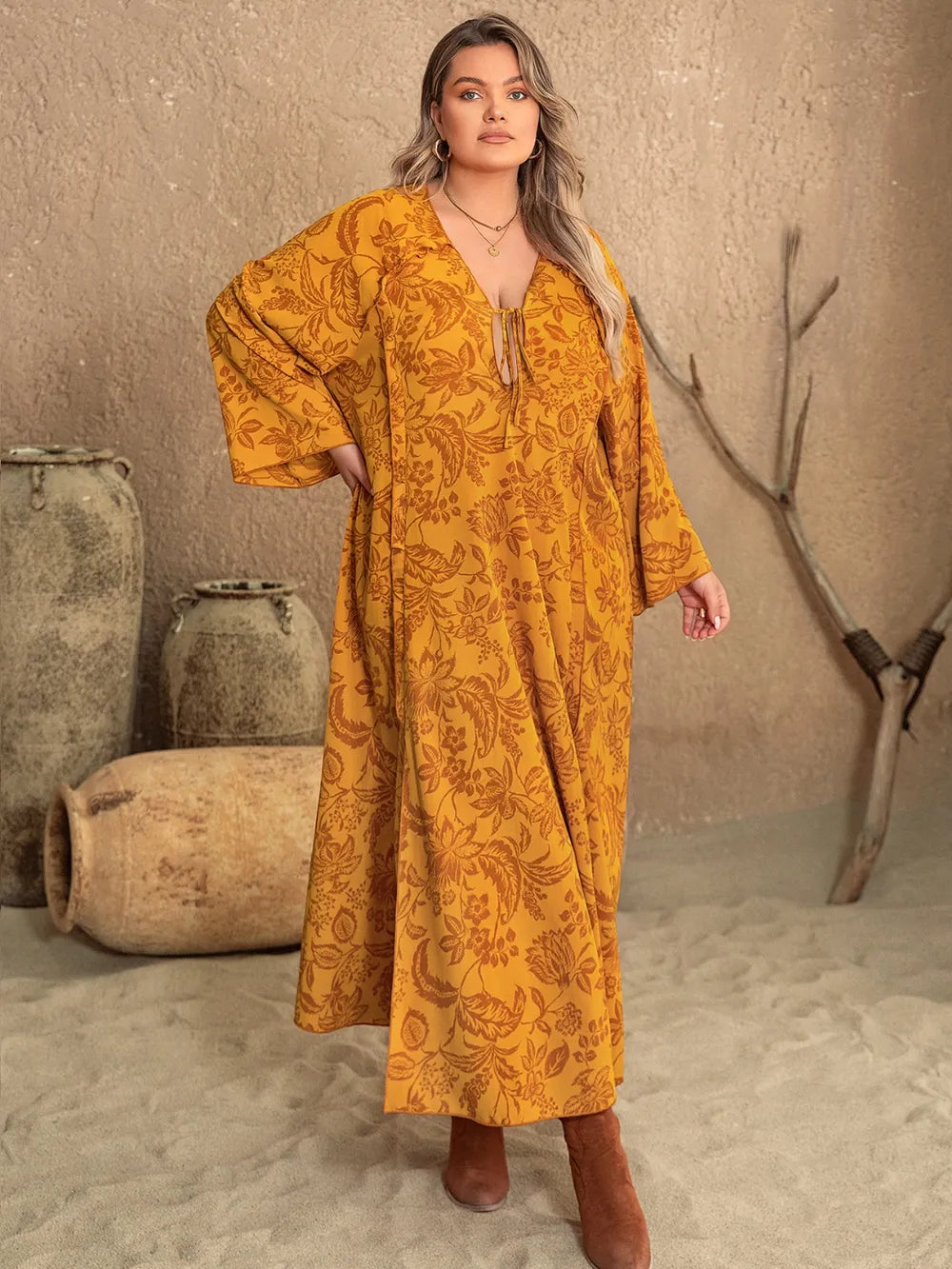 Plus Size Printed Slit Long Sleeve Dress - Premium Dresses from Trendsi - Just $41.99! Shop now at Handbags Specialist Headquarter