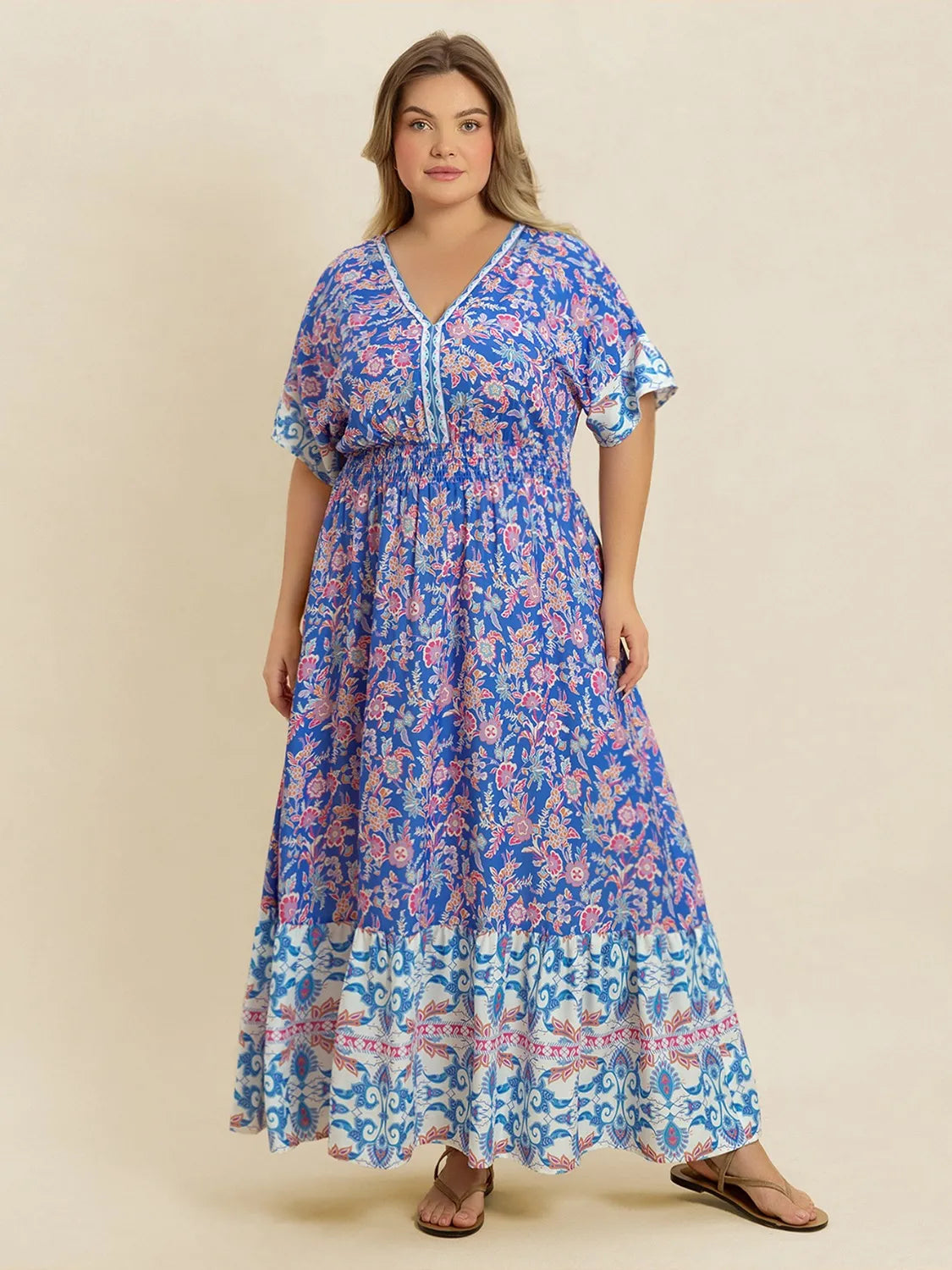 Plus Size Smocked Printed Half Sleeve Midi Dress - Premium Dresses from Trendsi - Just $43.99! Shop now at Handbags Specialist Headquarter