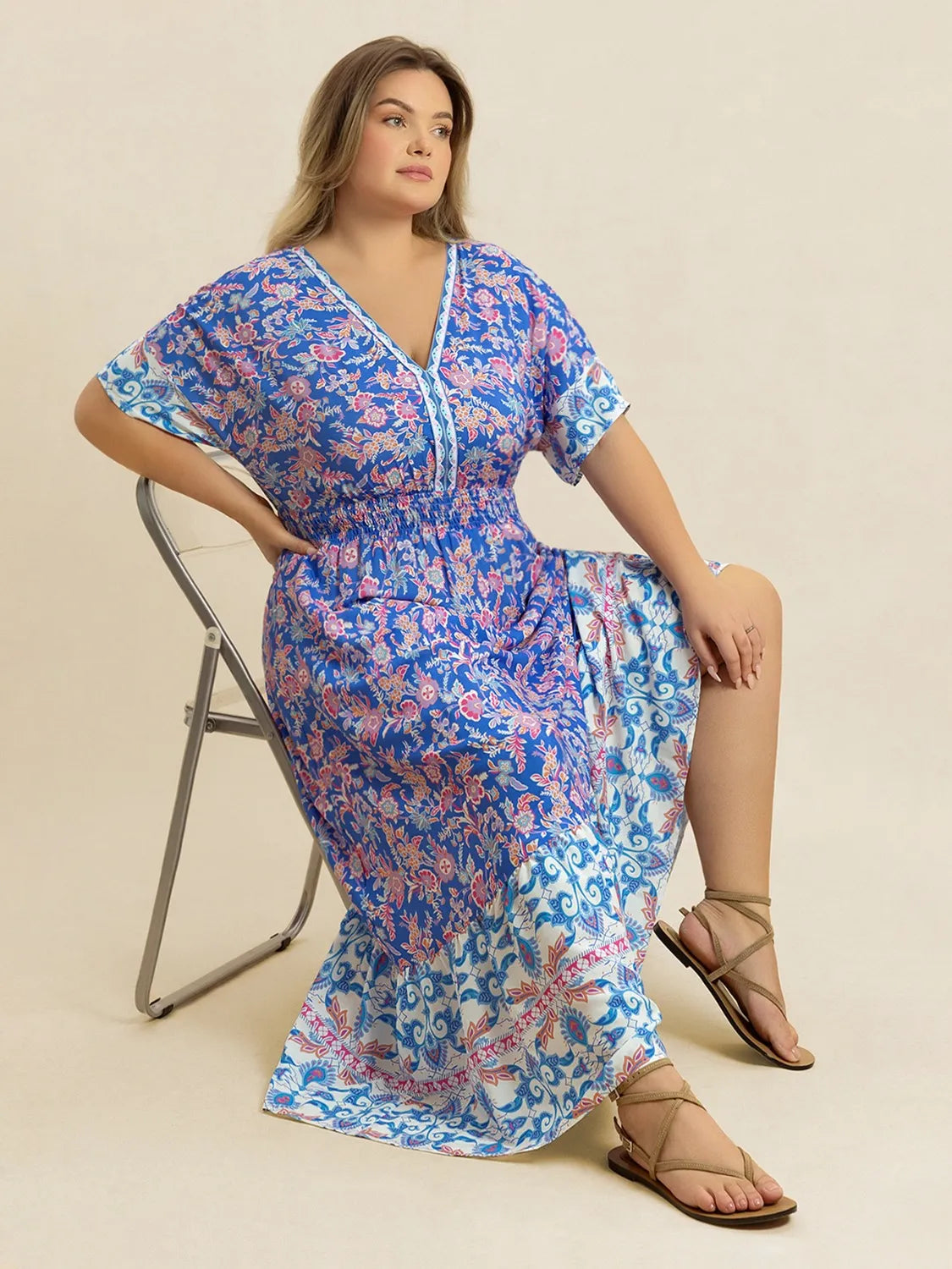 Plus Size Smocked Printed Half Sleeve Midi Dress - Premium Dresses from Trendsi - Just $43.99! Shop now at Handbags Specialist Headquarter