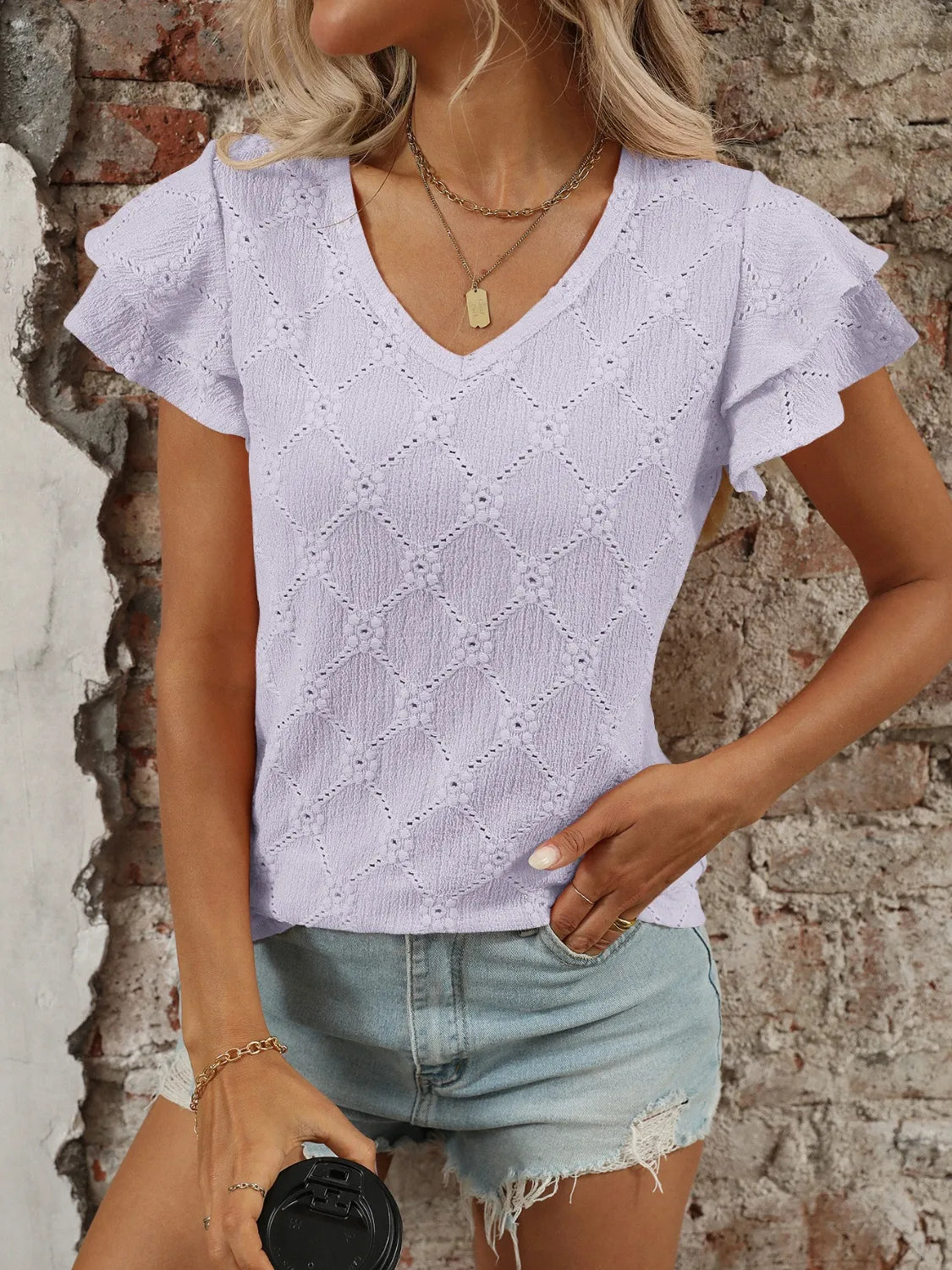 Eyelet V-Neck Ruffled Cap Sleeve Top - Premium Tops from Trendsi - Just $20.68! Shop now at Handbags Specialist Headquarter