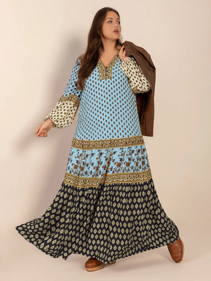 Plus Size Printed V-Neck Balloon Sleeve Maxi Dress - Premium Dresses from Trendsi - Just $52.99! Shop now at Handbags Specialist Headquarter