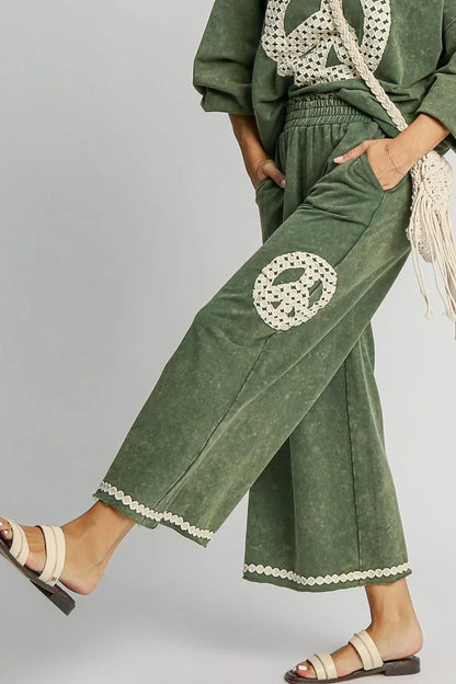 Umgee Full Size Peace Lace Applique Mineral Wash Wide Leg Pants Plus Size - Premium Dresses from Trendsi - Just $53.99! Shop now at Handbags Specialist Headquarter