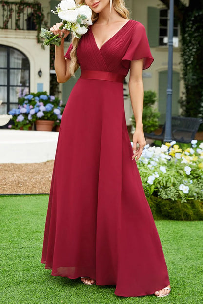 Surplice Flutter Sleeve Maxi Dress - Premium Maxi Dress from Trendsi - Just $40.99! Shop now at Handbags Specialist Headquarter