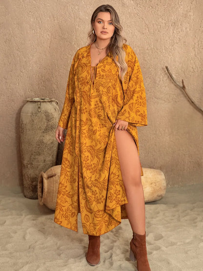Plus Size Printed Slit Long Sleeve Dress - Premium Dresses from Trendsi - Just $41.99! Shop now at Handbags Specialist Headquarter