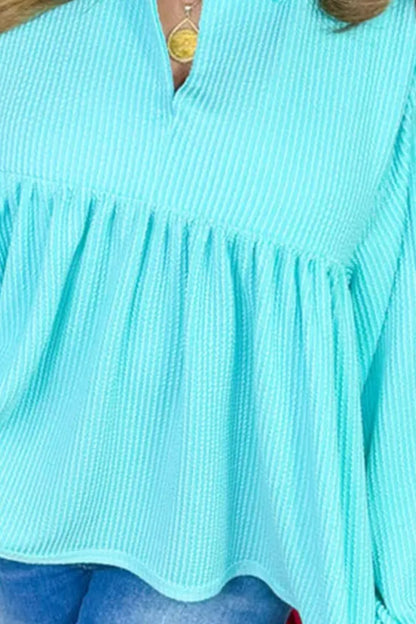 Plus Size Textured Peplum Long Sleeve Blouse - Premium Plus Size Shirts from Trendsi - Just $45.60! Shop now at Handbags Specialist Headquarter